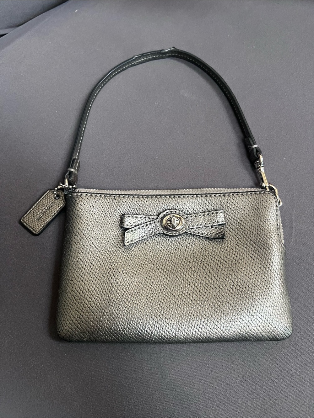 Coach Metallic Grey Wristlet  with Bow Accent